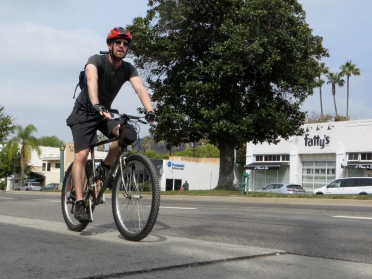 Cyclist enjoying the new buffered bike lanes.